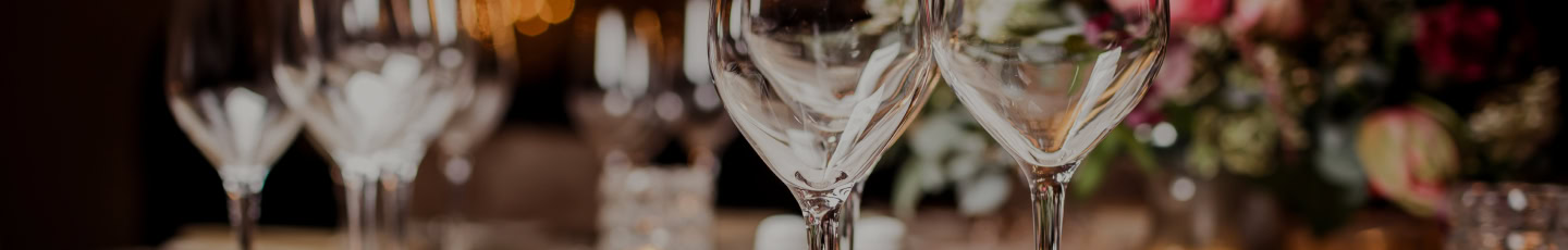 Elegant wine glasses set on a table at Ruth's Chris Steak House, perfect for fine dining and special occasions.